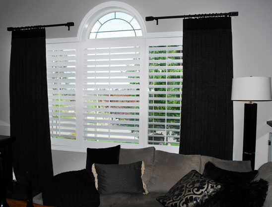 Blinds layered with drapes