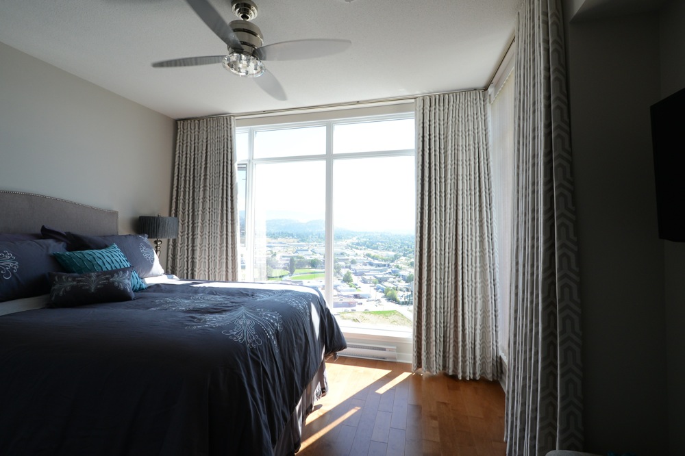 custom bedding and drapes for condo bedroom | The Well Dressed Window - Hunter Douglas Blinds