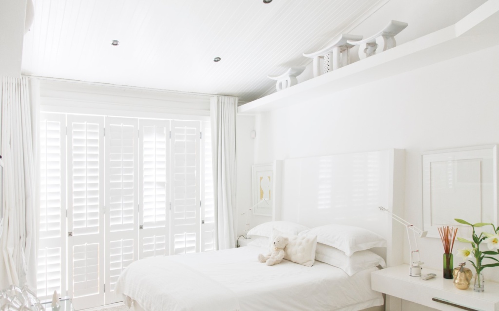 Built-in shutters in bedroom